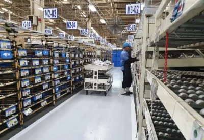 Warehouse worker order picking with a cart